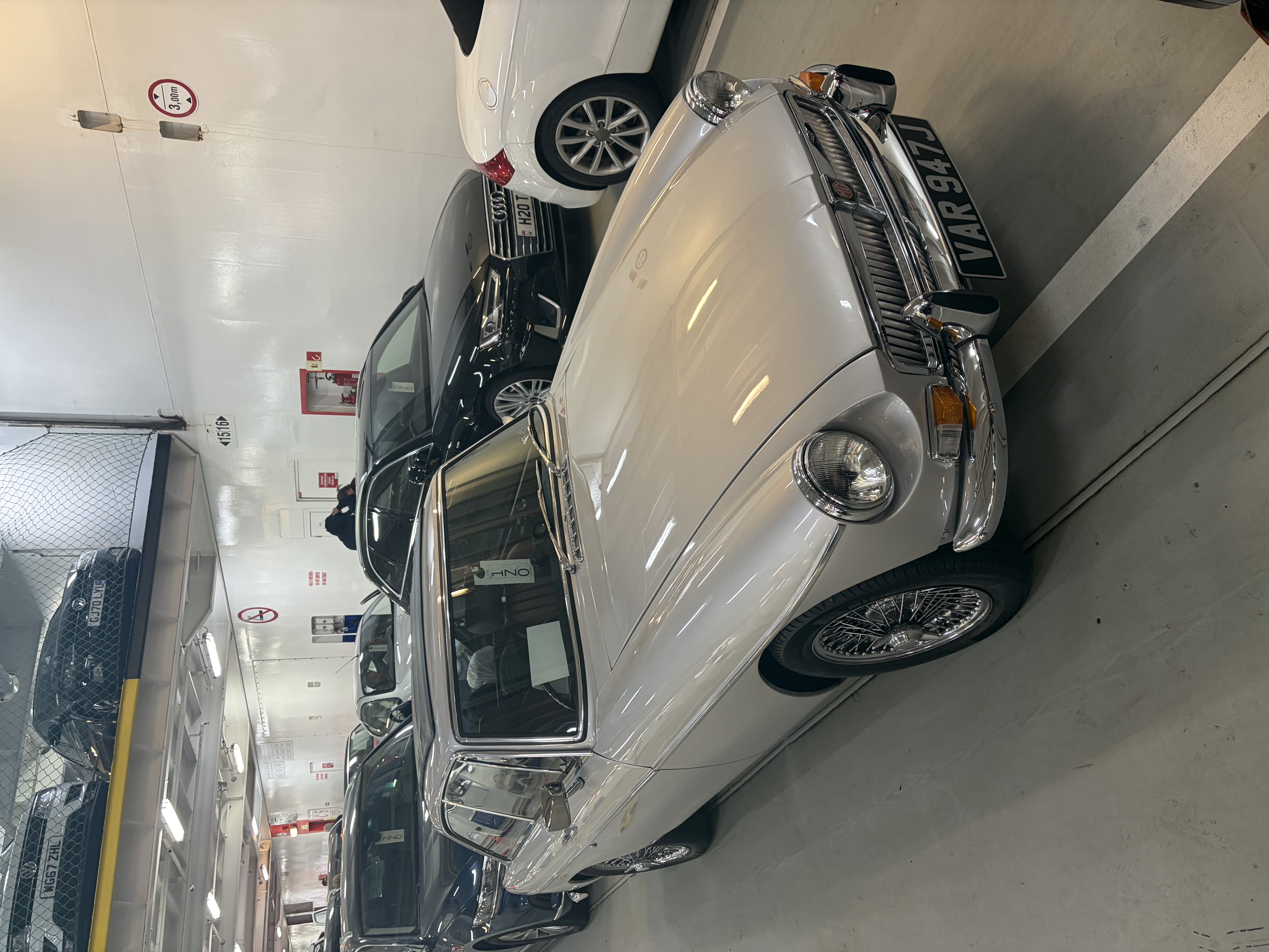 Finished silver 1971 MGB GT photographed on a ferry deck